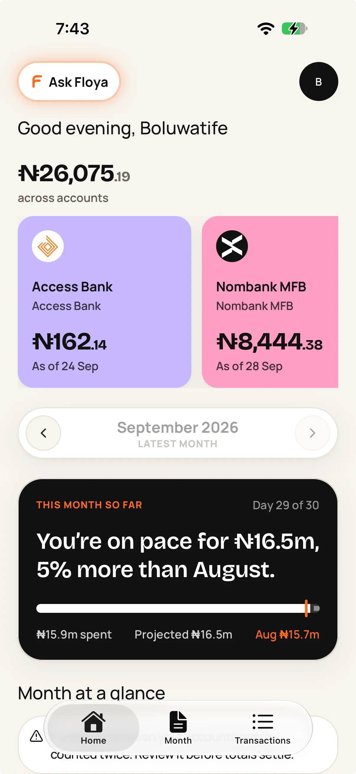 Floya home screen: total balance across accounts, a card per bank, and how this month’s spending is pacing against last month